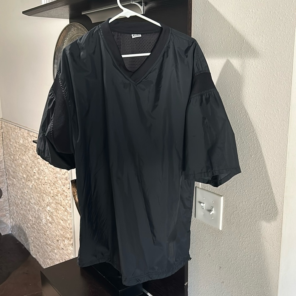 Pro V2 short sleeve, windbreaker, size large, with pull string at the bottom.